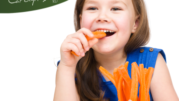 Little girl eating carrots